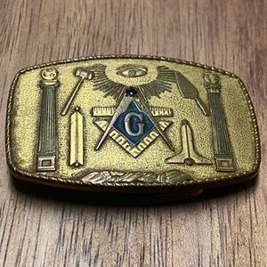 A vintage Masonic brass belt buckle